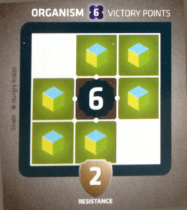 An organism card which needs six tiles around it to score six victory points.