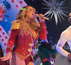 Mariah singing, wearing a nutcracker inspired costume