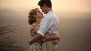 two adults in WW2 era clothes embrace