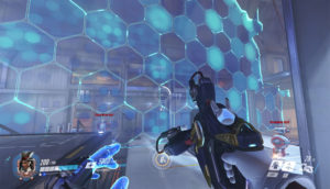 A wide and tall barrier with blue, shiny squares